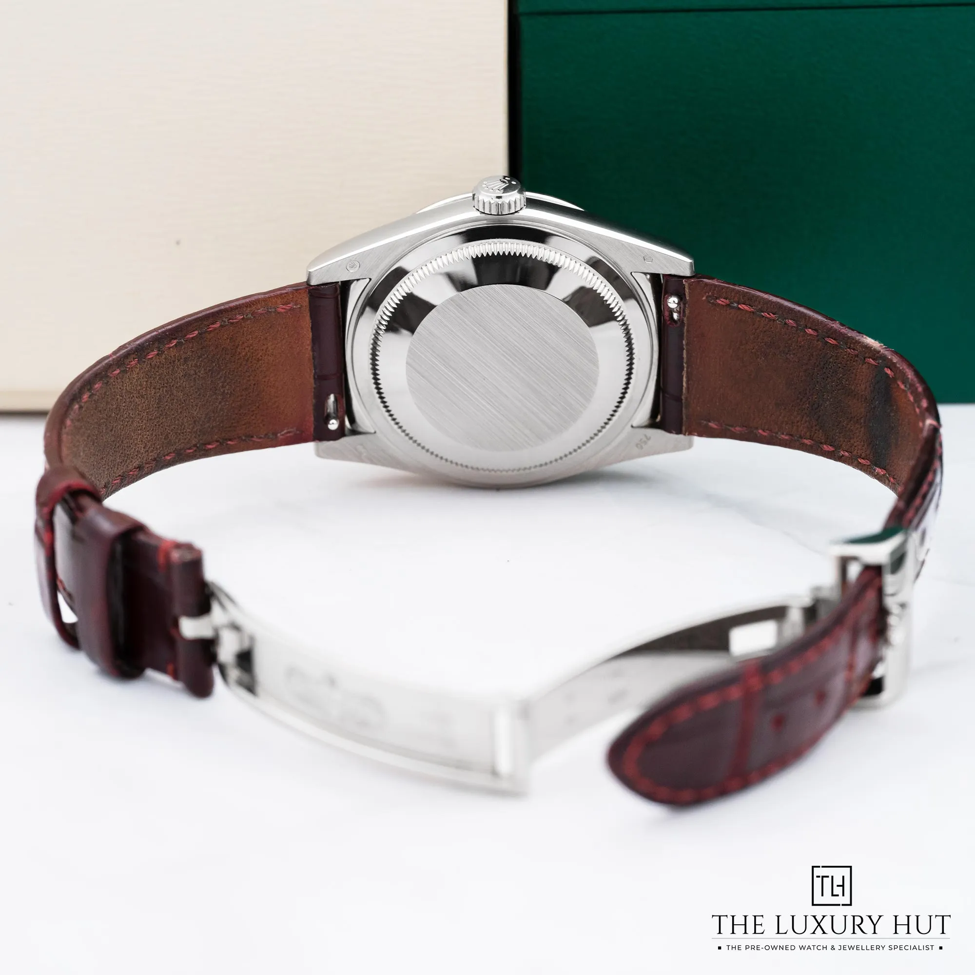 2025/10/93e2dc52-874e-4c9d-9d3c-67f9a421c22cRolex_Day-Date_White_Gold_36_Cherry_Dial_New_39299-c.webp